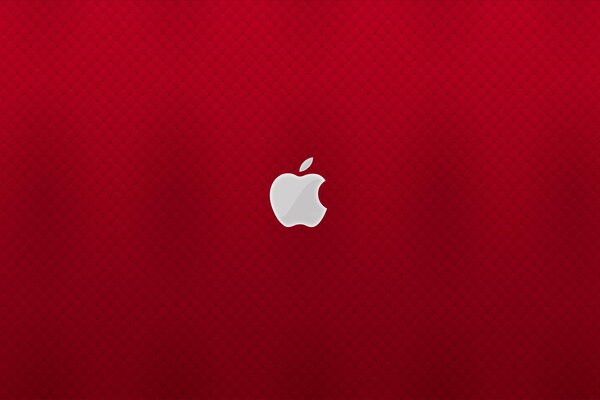 Emblematy apple na czerwonym tle