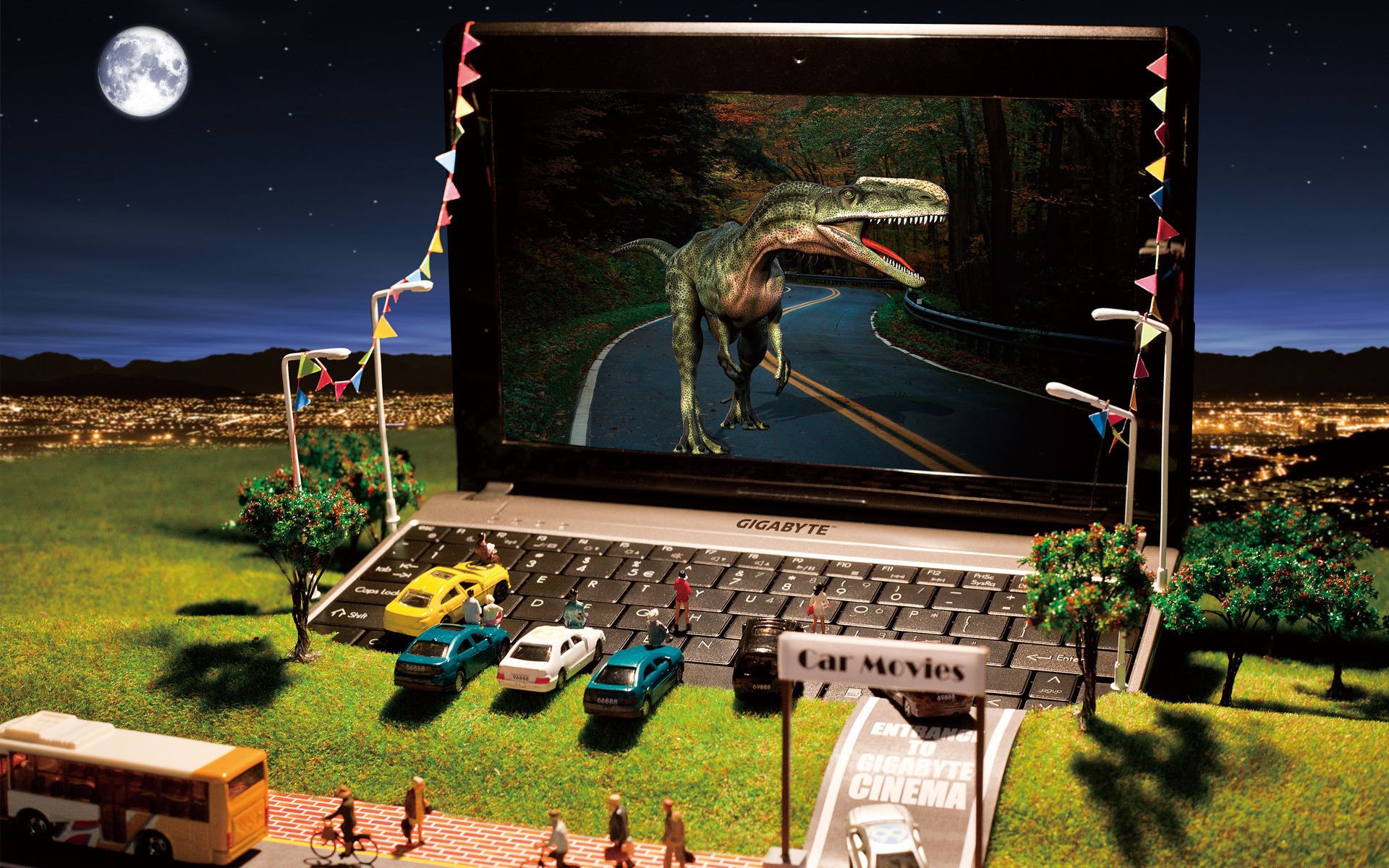 gigabyte modele netbook miniatura kino samochody dinozaur wzgórze miasto zabawki latarki laptop drzewa