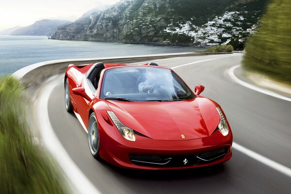 Czerwone Ferrari na wiejskiej drodze