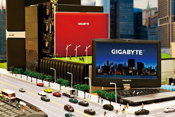Reklama laptopa gigabyte w miniaturze z maszynami i ludźmi