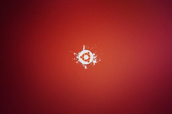 Minimalistyczne logo Ubuntu na czerwonym tle z rozpryskami