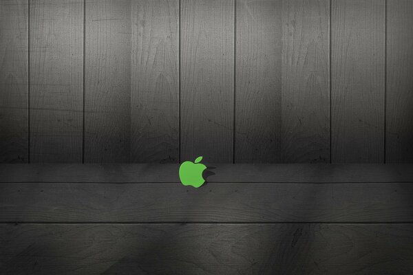 Zielone logo apple na tle tablic