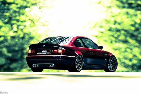 Wiśniowe BMW na tle drzew i trochę Photoshopa