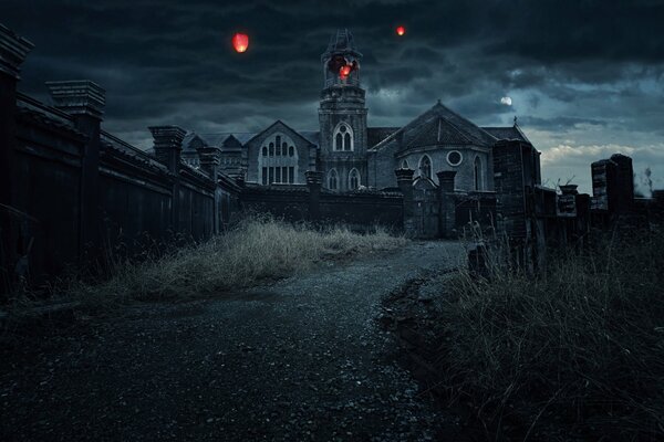 Zdjęcie nocnego klasztoru z latarniami na niebie