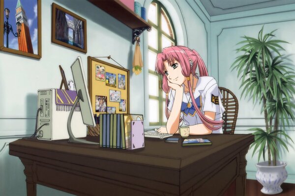 Dziewczyna z anime przy biurku komputerowym